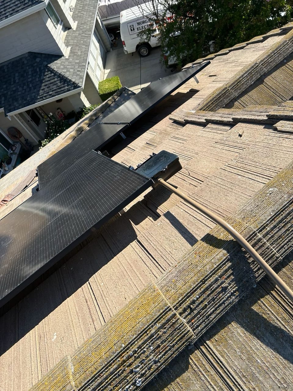 Solar panels and equipment on a rooftop during installation