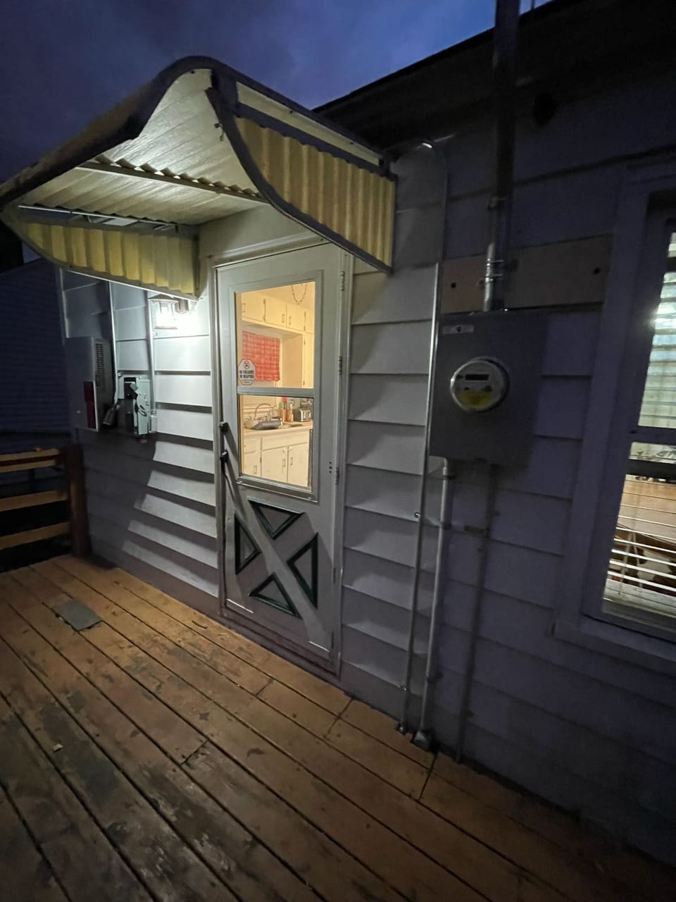 Home entry at dusk with solar electrical equipment installed