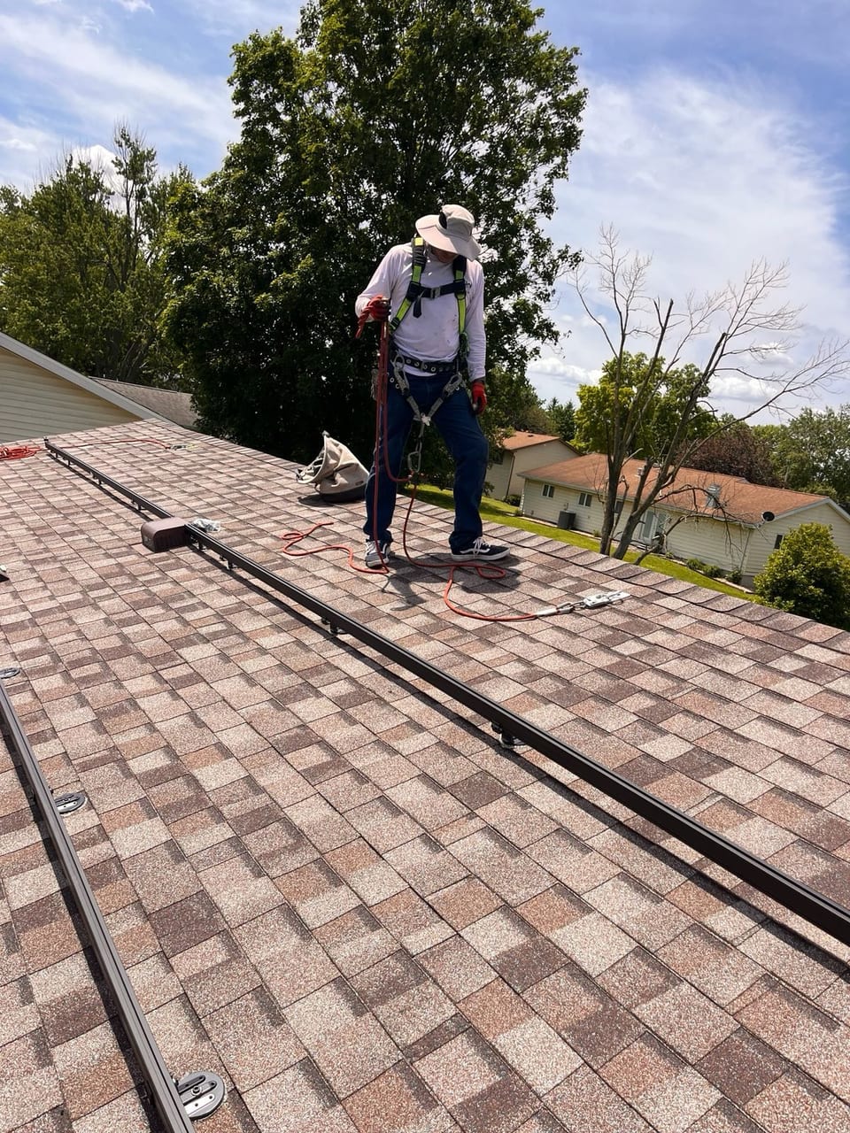 ETW Energy installer at work on a residential rooftop